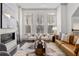 Stylish living room featuring a modern fireplace, a cozy seating area, and lots of natural light at 607 Broadview Ter, Atlanta, GA 30324