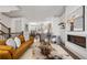 Open concept living room flowing into a dining area and kitchen, with a fireplace feature wall at 607 Broadview Ter, Atlanta, GA 30324