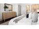 Bright main bedroom featuring neutral colors and a large dresser at 607 Broadview Ter, Atlanta, GA 30324