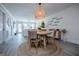 Open concept dining area with a round wooden table and woven chairs at 705 Berry Ct, Villa Rica, GA 30180