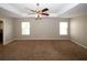 Spacious carpeted bedroom with ceiling fan and two windows at 3301 Cascade Parc Blvd, Atlanta, GA 30311