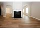 Living room featuring a fireplace, hardwood floors, and an open floor plan at 3301 Cascade Parc Blvd, Atlanta, GA 30311