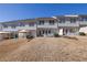 Backyard view of townhome exteriors and patios at 55 Burns View Ct, Lawrenceville, GA 30044