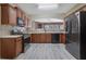 Modern kitchen with wood cabinets, stainless steel appliances, and tiled backsplash at 55 Burns View Ct, Lawrenceville, GA 30044