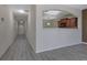 Hallway view to kitchen, features updated floors and neutral walls at 55 Burns View Ct, Lawrenceville, GA 30044