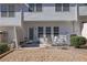 Back patio with seating area and exterior access at 55 Burns View Ct, Lawrenceville, GA 30044