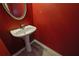 Powder room featuring a pedestal sink and laminate flooring at 55 Burns View Ct, Lawrenceville, GA 30044