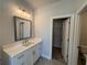 Bathroom with vanity, mirror, and linen closet at 140 Birch Tree Way, Cumming, GA 30040