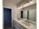 Bathroom with double vanity, quartz countertop, and updated fixtures at 140 Birch Tree Way, Cumming, GA 30040