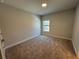 Bright bedroom with neutral walls and plush carpeting at 140 Birch Tree Way, Cumming, GA 30040