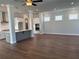 Open living room with hardwood floors and kitchen island at 140 Birch Tree Way, Cumming, GA 30040