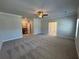 Spacious main bedroom with ceiling fan and carpet at 140 Birch Tree Way, Cumming, GA 30040