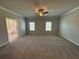 Large main bedroom with en-suite bathroom access at 140 Birch Tree Way, Cumming, GA 30040