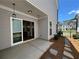 Private patio with stone pathway and access to kitchen at 140 Birch Tree Way, Cumming, GA 30040