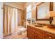 Bathroom featuring granite vanity top, dark wood cabinets, and shower-tub combination at 2240 Palmour Ct, Atlanta, GA 30337