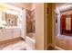 Hall bathroom with shower/tub combo and marble countertop vanity at 2240 Palmour Ct, Atlanta, GA 30337