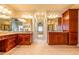 Bathroom with dual vanity and granite countertops, soaking tub in separate room at 2240 Palmour Ct, Atlanta, GA 30337