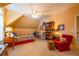 Bedroom featuring tan walls, a single bed, built in bookshelves and ceiling fan at 2240 Palmour Ct, Atlanta, GA 30337