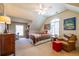 Bedroom featuring tan walls, a single bed, reading chair and natural light at 2240 Palmour Ct, Atlanta, GA 30337