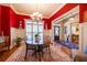 Elegant dining room with hardwood floors, chandelier, and large windows providing plenty of light at 2240 Palmour Ct, Atlanta, GA 30337