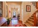 Spacious foyer with hardwood floors, staircase, elegant décor, and a welcoming entrance at 2240 Palmour Ct, Atlanta, GA 30337