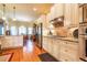 Spacious kitchen featuring stainless steel appliances, custom cabinets, granite countertops and hardwood flooring at 2240 Palmour Ct, Atlanta, GA 30337