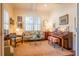 Cozy living room filled with natural light, featuring a floral sofa and beautiful artwork at 2240 Palmour Ct, Atlanta, GA 30337
