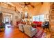Open living room features high ceilings, a staircase, wood floors and comfortable seating at 2240 Palmour Ct, Atlanta, GA 30337