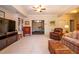 Spacious living room features built-in shelving, a comfortable armchair and colorful couch at 2240 Palmour Ct, Atlanta, GA 30337