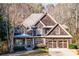 Charming two-story home with brown siding, stone accents, and a well-maintained front yard at 2240 Palmour Ct, Atlanta, GA 30337