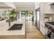 Modern kitchen with marble countertops, stainless steel appliances, and a large island at 3423 Pinestream Nw Rd, Atlanta, GA 30327