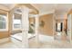 Bright bathroom with a large soaking tub framed by decorative columns and elegant tile work at 110 Robinwood Ct, Fayetteville, GA 30214