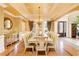 Formal dining room with hardwood floors, chandelier, and large windows at 110 Robinwood Ct, Fayetteville, GA 30214