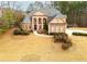 Stately two-story residence with a sprawling front yard and mature trees at 110 Robinwood Ct, Fayetteville, GA 30214