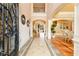 Elegant foyer with decorative tile flooring and a wrought iron accented staircase at 110 Robinwood Ct, Fayetteville, GA 30214