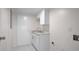 Bright laundry room with white cabinets and a utility sink at 2769 Peachtree Ne Rd # 10, Atlanta, GA 30305