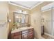 Bathroom with granite vanity, large mirror, and toilet at 4035 Powerscourt Pl, Suwanee, GA 30024