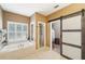 Spa-like bathroom with soaking tub, shower, and barn door at 4035 Powerscourt Pl, Suwanee, GA 30024