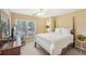 Spacious bedroom with a post bed and large windows at 4035 Powerscourt Pl, Suwanee, GA 30024