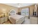 Cozy bedroom with a ceiling fan and plenty of natural light at 4035 Powerscourt Pl, Suwanee, GA 30024