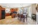 Breakfast nook with a wood table and chairs, adjacent to a well-equipped kitchen at 4035 Powerscourt Pl, Suwanee, GA 30024