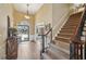 Spacious entryway with hardwood floors, staircase, and high ceilings at 4035 Powerscourt Pl, Suwanee, GA 30024