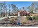 Brick home with a large yard and mature trees, perfect for families at 4035 Powerscourt Pl, Suwanee, GA 30024