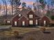 Brick house with landscaping at 4035 Powerscourt Pl, Suwanee, GA 30024