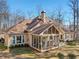 Tan house with large screened porch at 4035 Powerscourt Pl, Suwanee, GA 30024