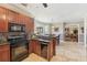 Spacious kitchen with granite countertops and stainless steel appliances at 4035 Powerscourt Pl, Suwanee, GA 30024