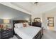 Main bedroom with ensuite bathroom access and large windows at 4035 Powerscourt Pl, Suwanee, GA 30024