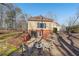 Cozy patio area with fire pit and seating, near garage at 4035 Powerscourt Pl, Suwanee, GA 30024