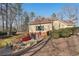 View of the patio area with fire pit and seating at 4035 Powerscourt Pl, Suwanee, GA 30024