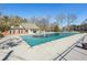 Community pool with safety cover and pool house at 4035 Powerscourt Pl, Suwanee, GA 30024